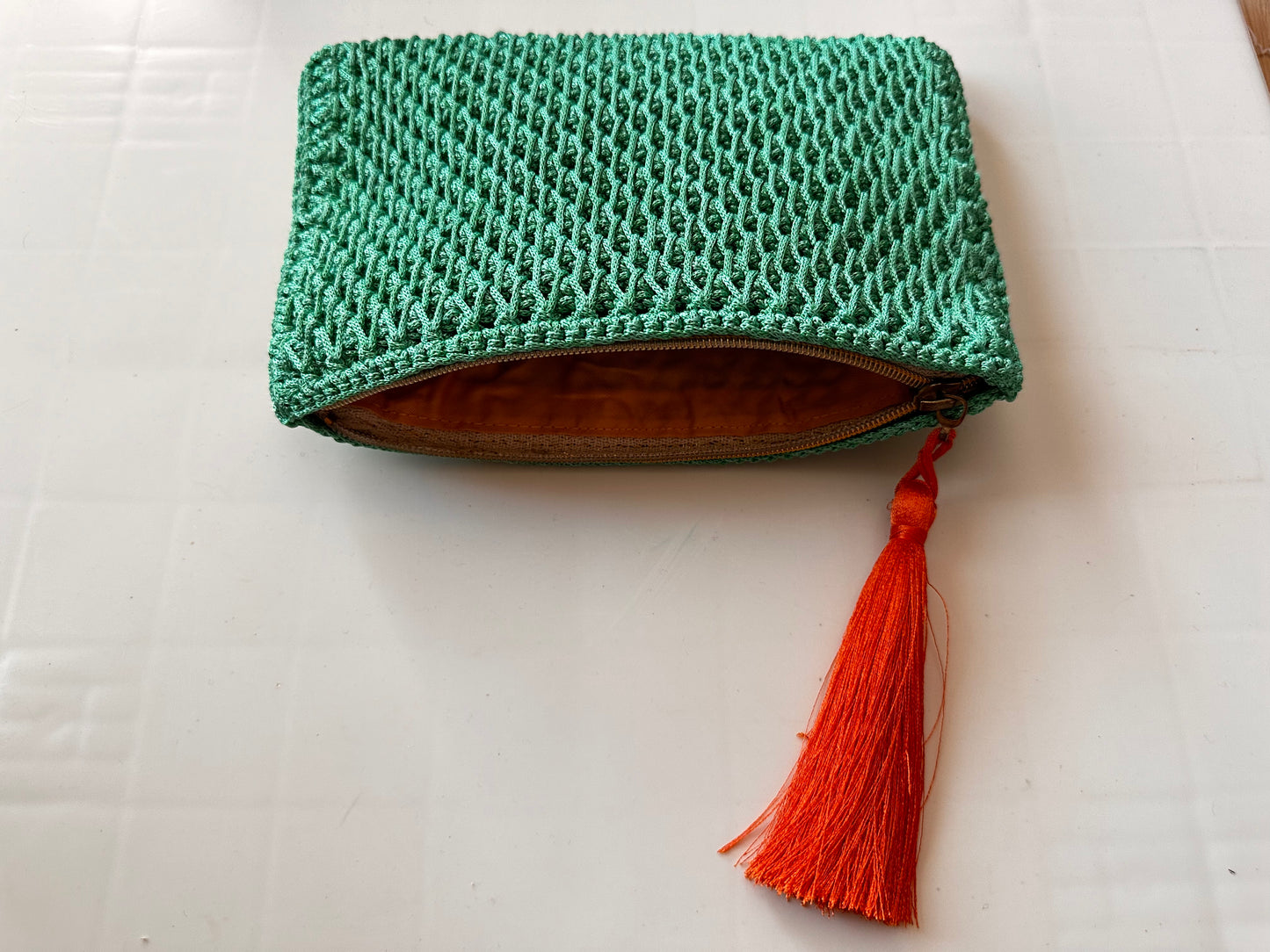 Green Hand-Crocheted Luxury Clutch Bag With Orange Tassel Detail